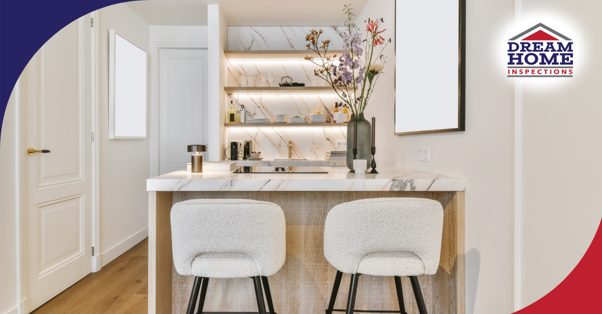 Elegant modern kitchen with marble island, open shelving, and bar stools.