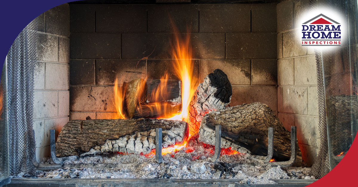Burning logs in a brick fireplace with glowing embers and flames.