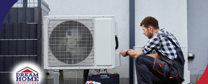 Technician inspecting outdoor HVAC system.